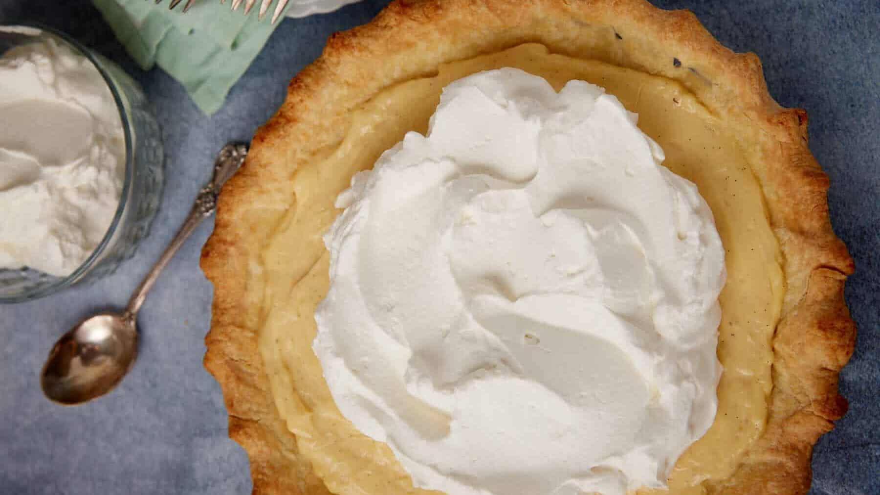 Slice of creamy vanilla pie on a plate.