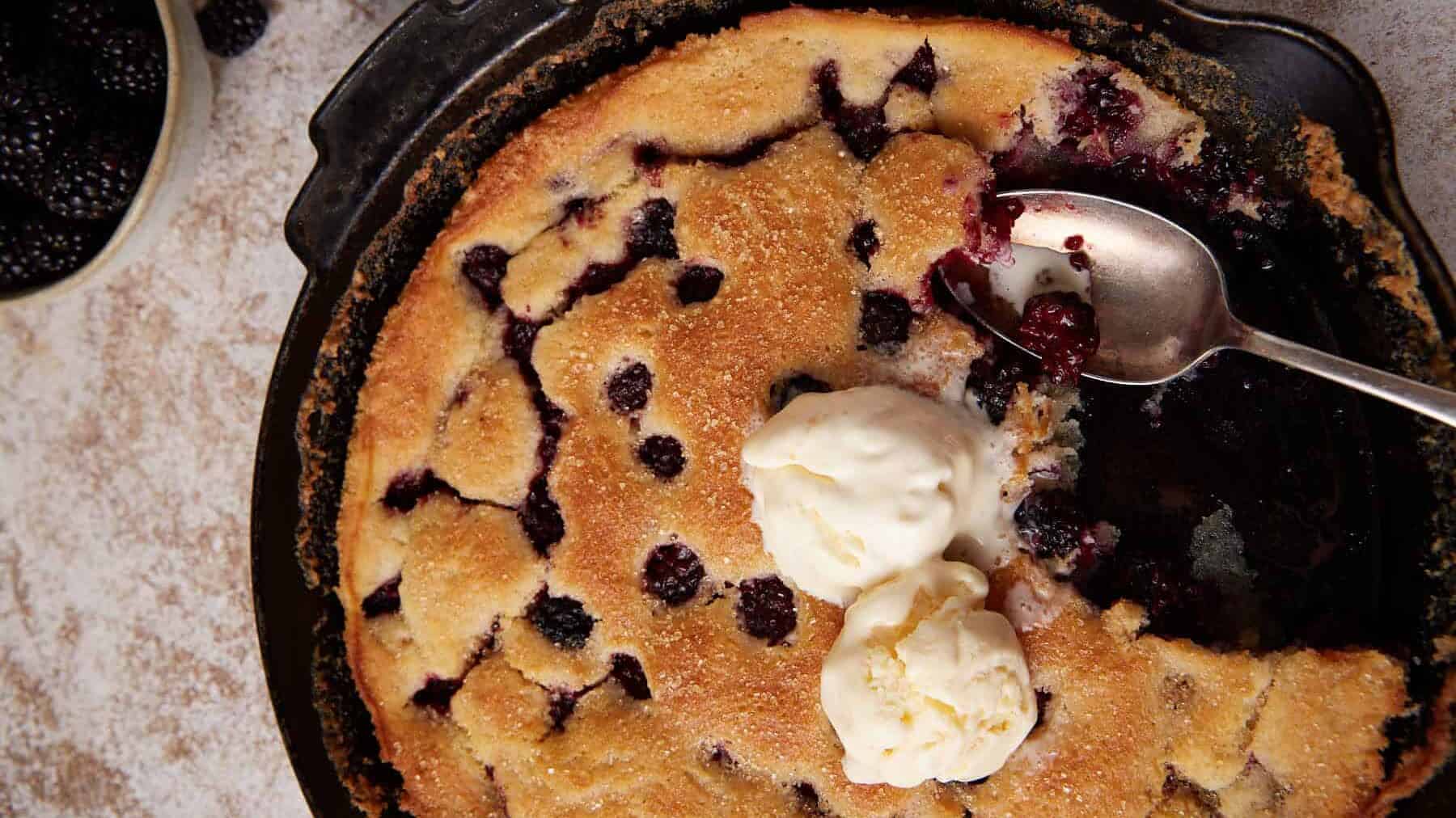 Ice cream topped blackberry skillet cobbler.