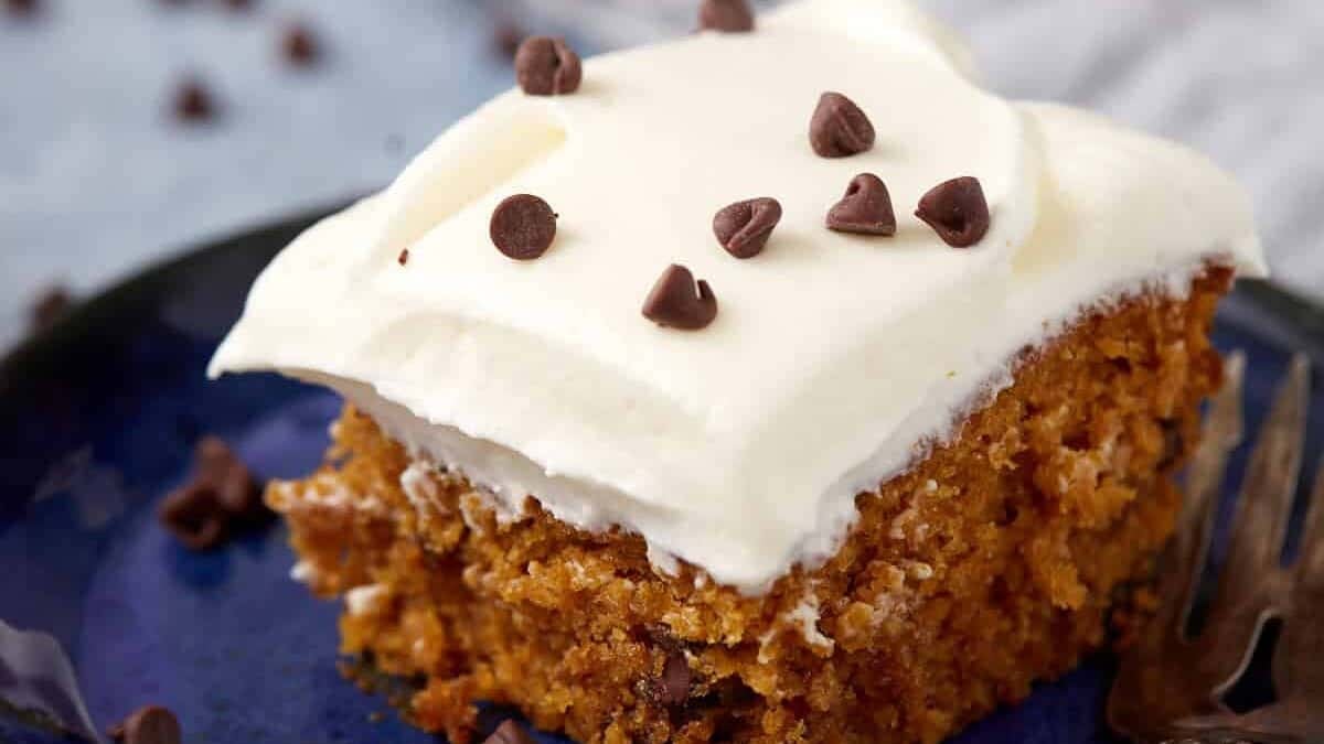 piece of pumpkin chocolate chip cake on a blue plate.