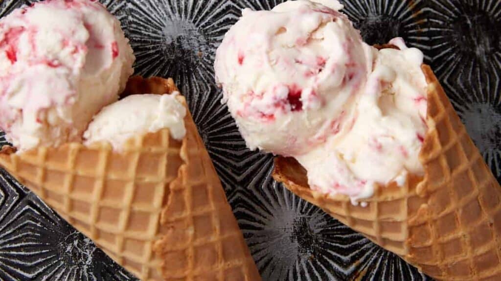 raspberry swirl ice cream in waffle cones.