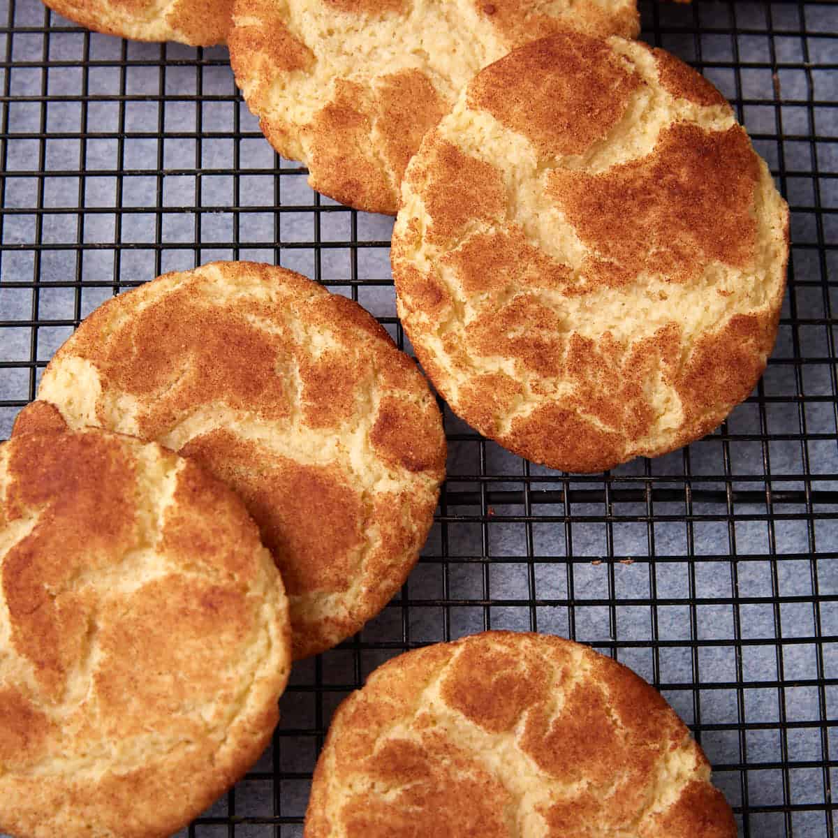snickerdoodle cookies on a wire rack.