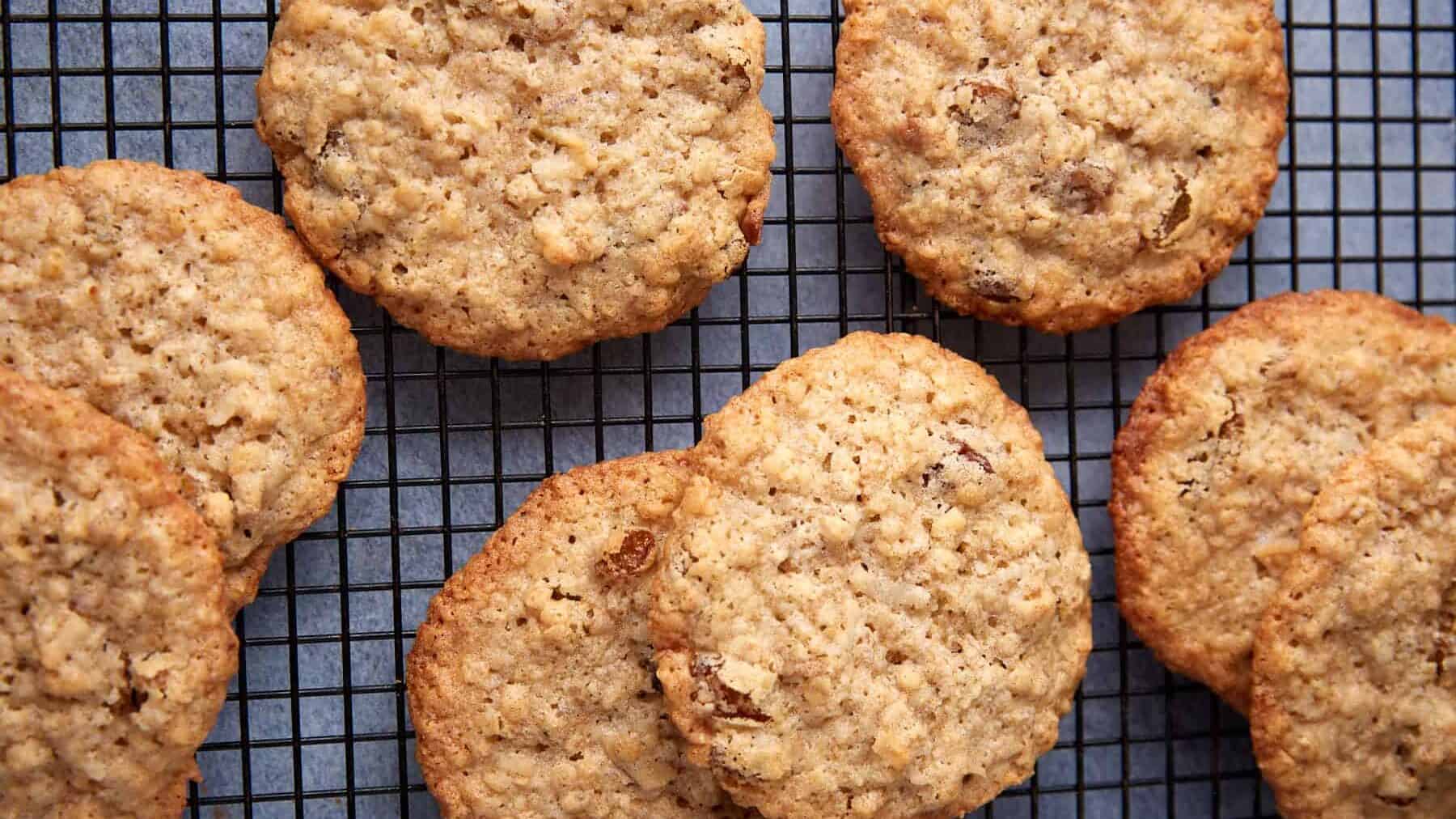 Oatmeal coconut cookies on a baking sheet.