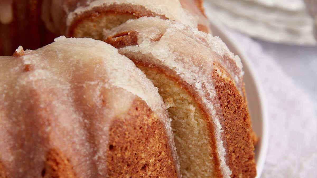A slice being removed from a bundt cake.