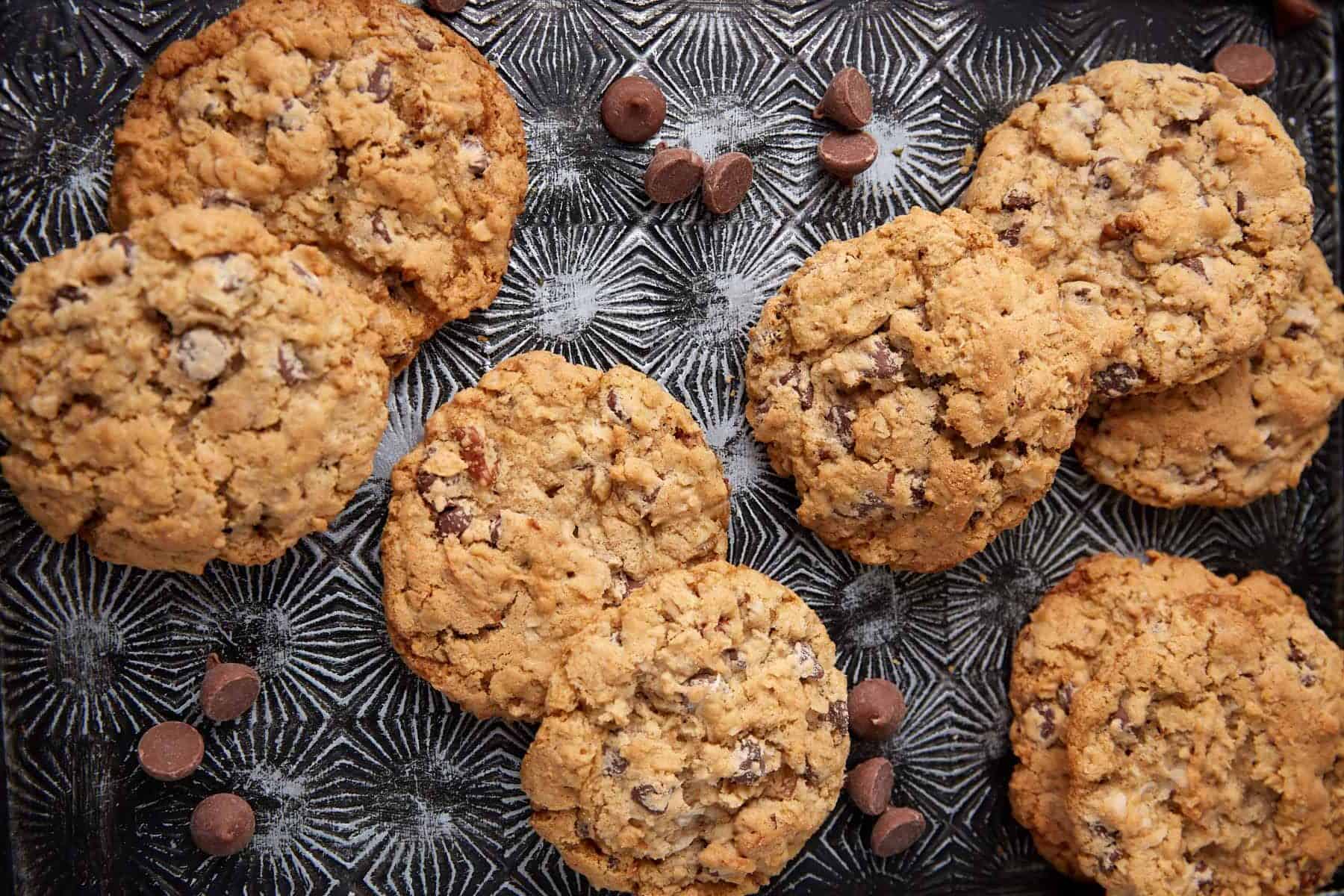 cowboy cookies on a glass plate.