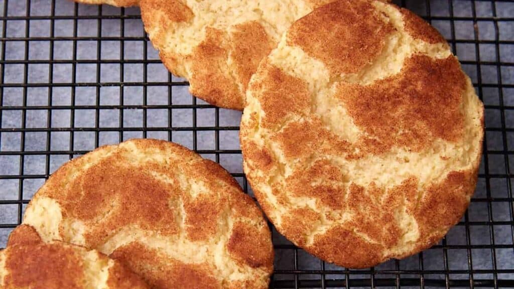 snickerdoodle cookies on a wire rack.