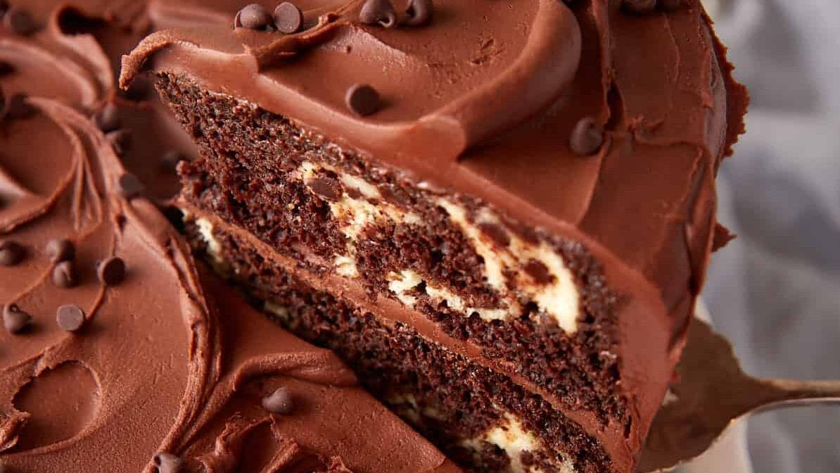 A slice of chocolate cream cheese cake.