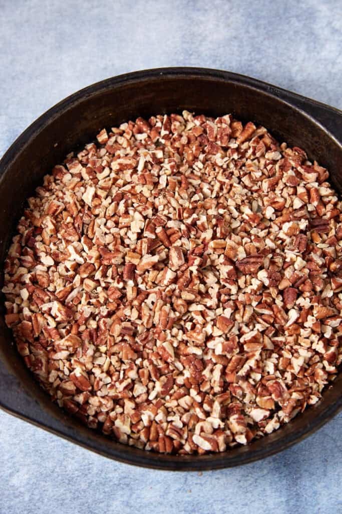 Chocolate mixture in a bowl after sugar has been added, ready to be whisked smooth.