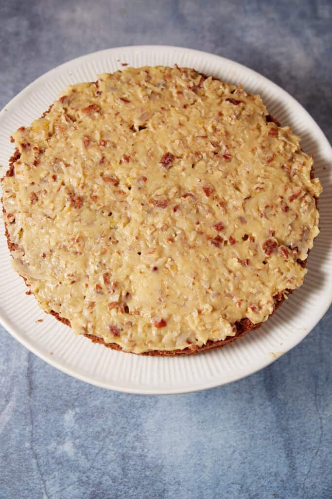 German chocolate cake filling ingredients in a saucepan before cooking, including evaporated milk, butter, sugar, and egg yolks.