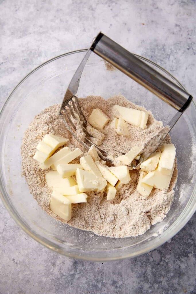Cold butter cut into the flour and spice mixture with a pastry cutter for the crumble topping.
