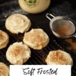 A reck of frosted eggnog cookies next to a sifter.