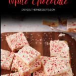Square white chocolate blondies topped with frosting and crushed peppermint pieces on a wooden board, with the text “Peppermint Blondies White Chocolate” above.